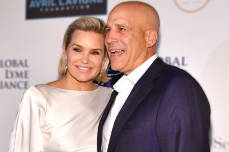 Joseph Jingoli in a black suit poses a picture with Yolanda Hadid.